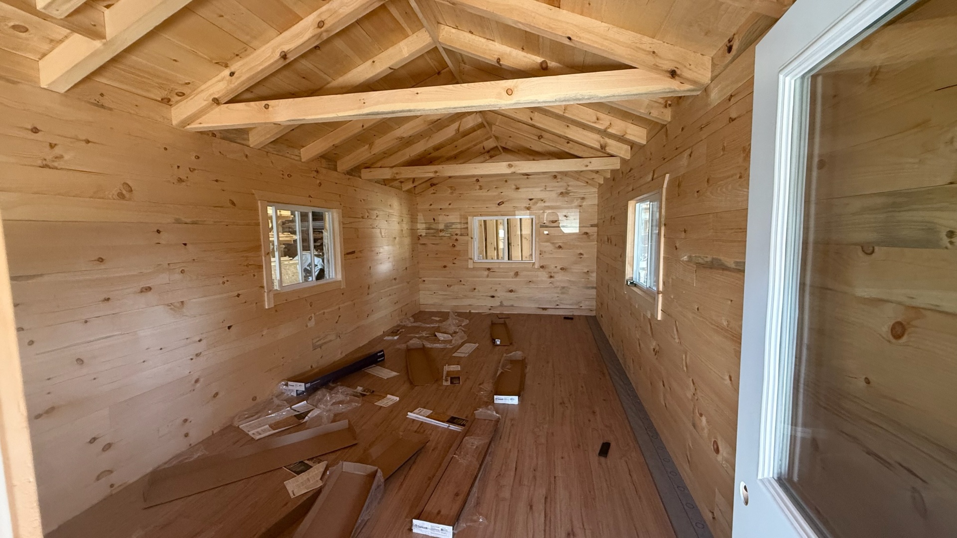 Cabin interior with full exposed rafter ceiling mid-finish